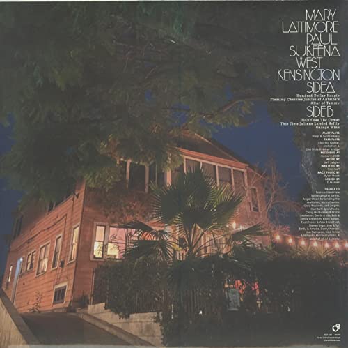 Vinyl record cover featuring a nighttime photograph of a large house.