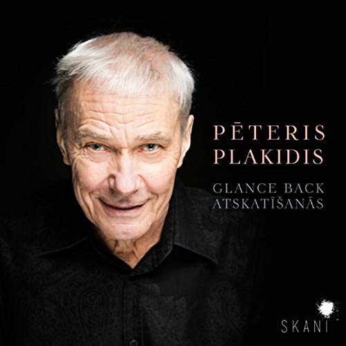 CD cover featuring a man with white hair against a black background.