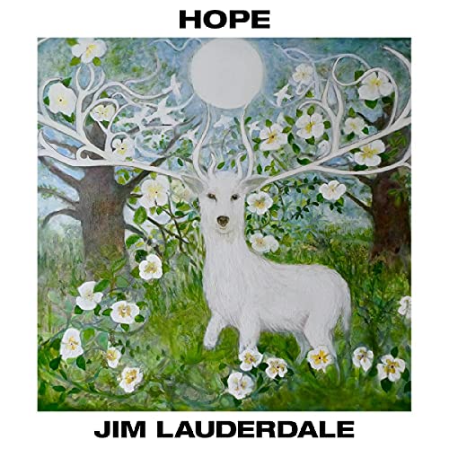 White deer with floral antlers standing in a field with trees and flowers.