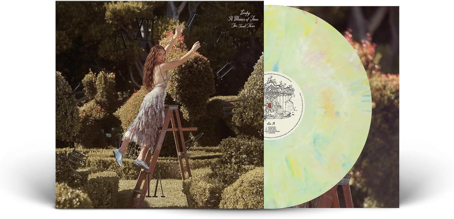 Laufey album cover and pale yellow vinyl record shown.