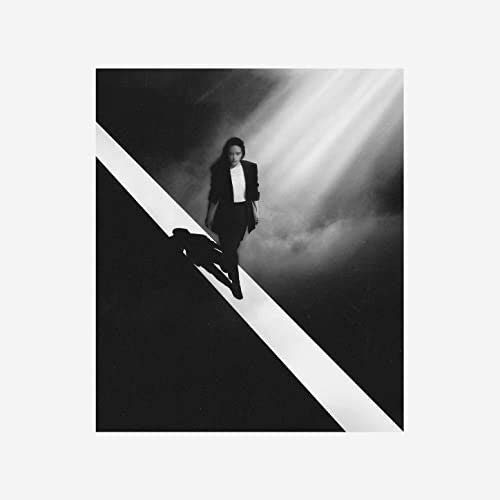 Black and white album cover featuring a woman in a suit.