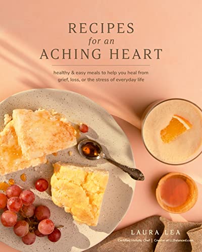 Cookbook cover with cake, grapes, drink, and text “Recipes for an Aching Heart.”