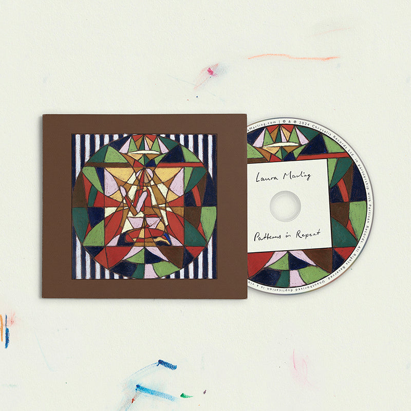 CD case with geometric windmill design and "Laura Marling - Patterns in Repeat" text.