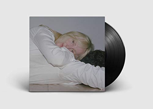 Vinyl record with album cover featuring a blonde woman reclining.