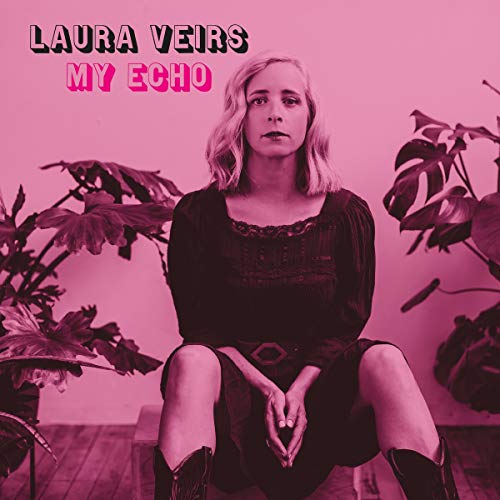 The image depicts a woman sitting between two plants with the text "LAURA VEIRS MY ECHO" above her. For accessibility purposes, a suitable alt text could be: "Album cover featuring a woman sitting between plants, pink-toned image."