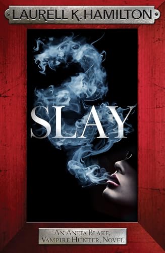 Book cover for Slay by Laurell K. Hamilton featuring blue smoke and a woman's face.