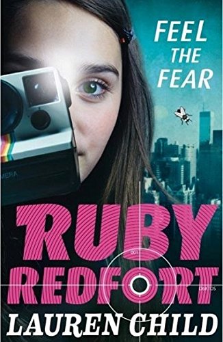 Girl with Polaroid camera, large text “RUBY REDFORT”, and a target reticle.