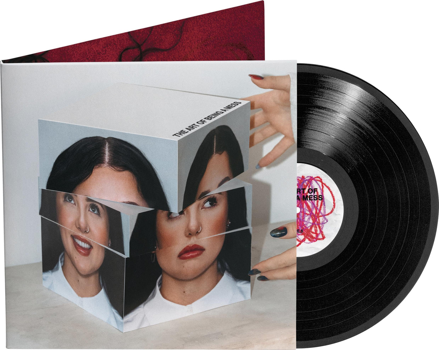 Vinyl record with album cover featuring a fragmented portrait of a woman.