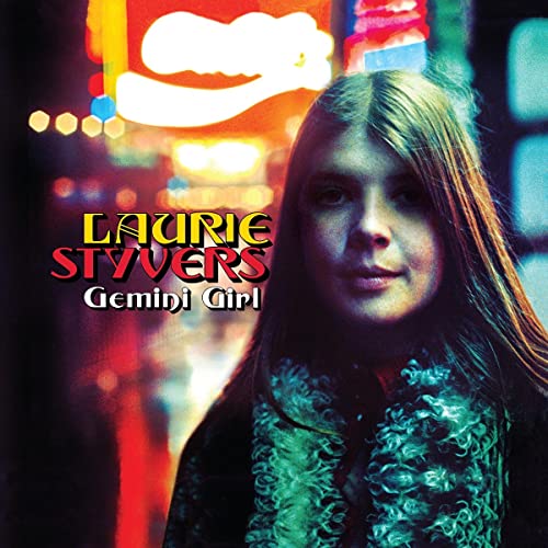 Album cover featuring Laurie Styvers, with neon lights blurred in background.