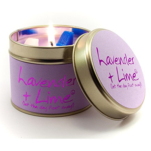 Purple tin candle with lit wick and lavender & lime label.