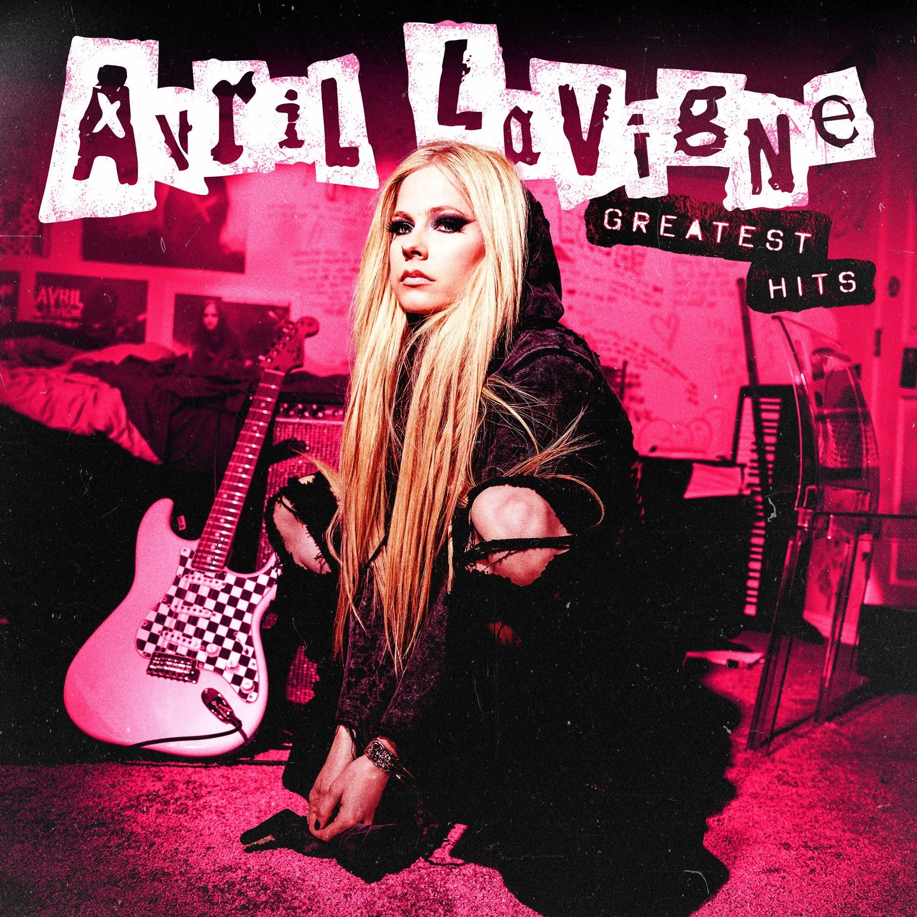 Avril Lavigne’s “Greatest Hits” CD cover featuring the artist with a guitar.