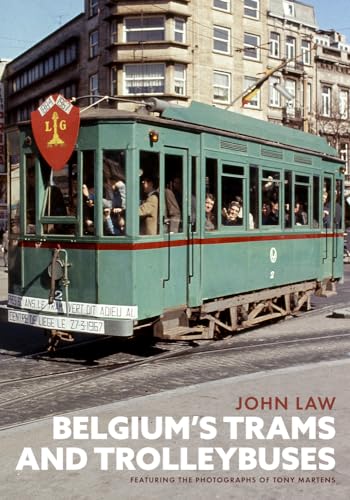 Vintage green Belgian tram with passengers on a city street.
