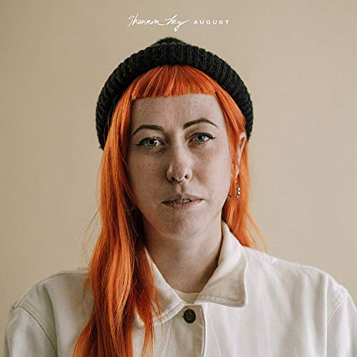 CD cover: woman with orange hair wearing a black beanie.