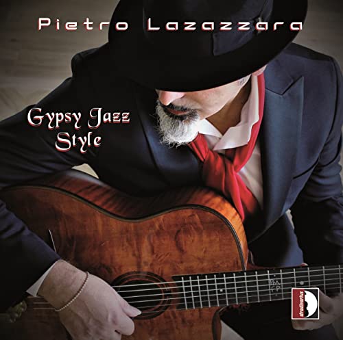 Man with guitar, wearing a hat and suit, album cover.