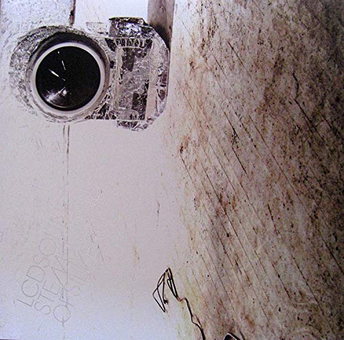 LCD Soundsystem vinyl album cover featuring a dirty camera lens on a white surface.