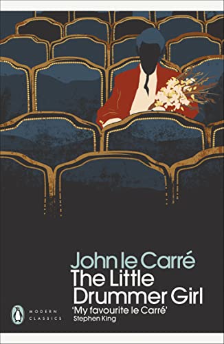 Book cover: silhouette of a person with flowers, dark blue background.