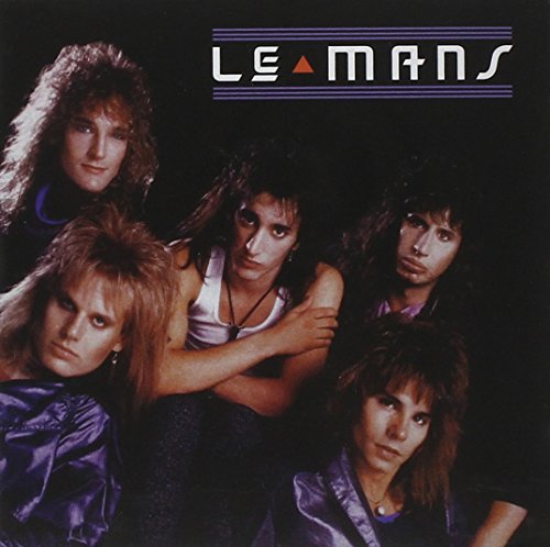1980s rock band portrait, "Le Mans" album cover, five members pictured.
