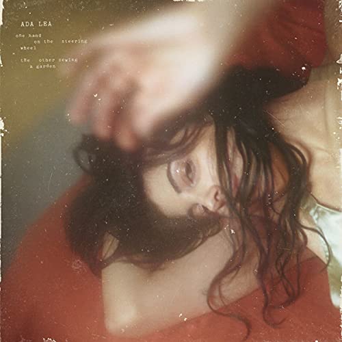 CD cover with a close-up of a person with closed eyes and dark hair.