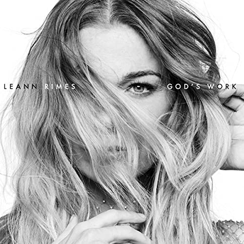 Black and white portrait of LeAnn Rimes with flowing hair, album cover.