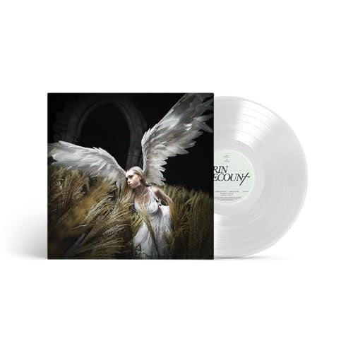 Vinyl record with cover art depicting a woman with large wings in a field.