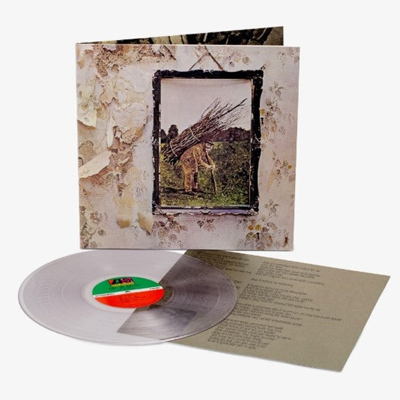 Led Zeppelin IV vinyl record jacket, clear vinyl disc, and lyric sheet on white background.
