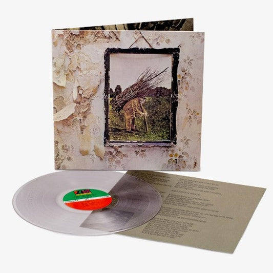 Led Zeppelin IV vinyl record jacket, clear vinyl disc, and lyric sheet on white background.