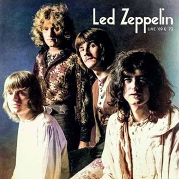 The four members of Led Zeppelin posing together on a dark background.