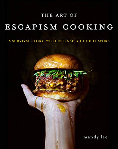 A hand holds a burger against a black background on a cookbook cover.