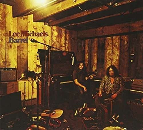 CD cover for Lee Michaels’ “Barrel” featuring musicians in a wood-paneled room.