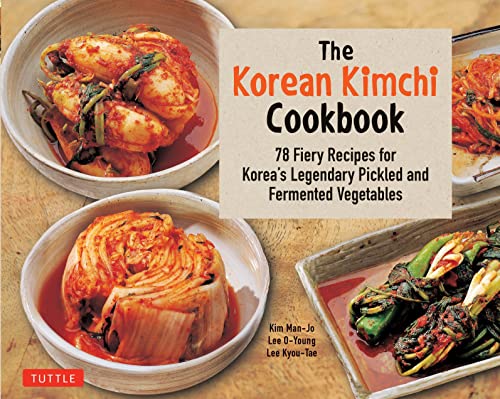 Cookbook cover featuring vibrant red kimchi in white bowls, text details title.