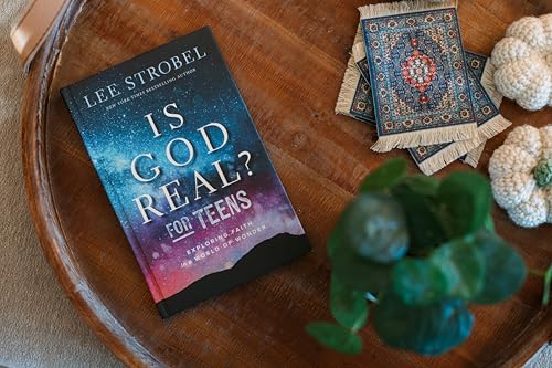 Book cover, “Is God Real? for Teens,” with decorative objects nearby.