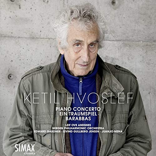 CD cover with older man in jacket and blue sweater against a concrete wall.