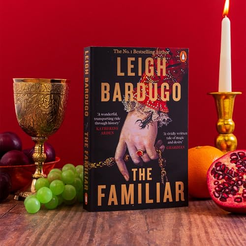 Book cover for “The Familiar” by Leigh Bardugo with fruit and candle.