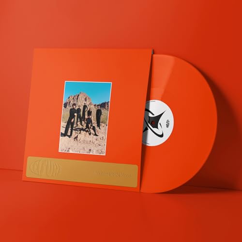 Orange vinyl record and sleeve featuring a photo of five people in a desert.