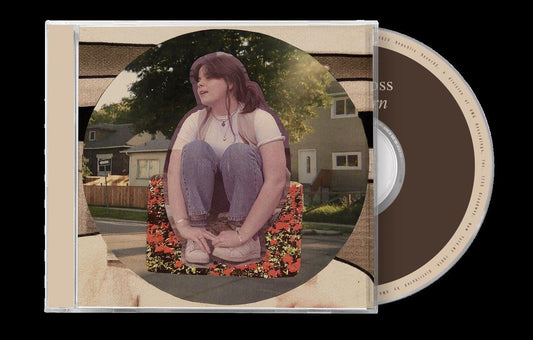 CD case featuring a woman sitting on a floral chair outdoors.