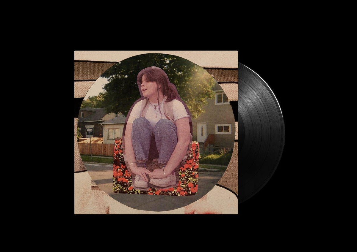 Vinyl record with album cover featuring a woman sitting outdoors.
