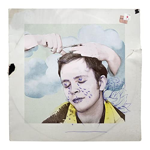 CD cover: man with painted face and hands styling hair.