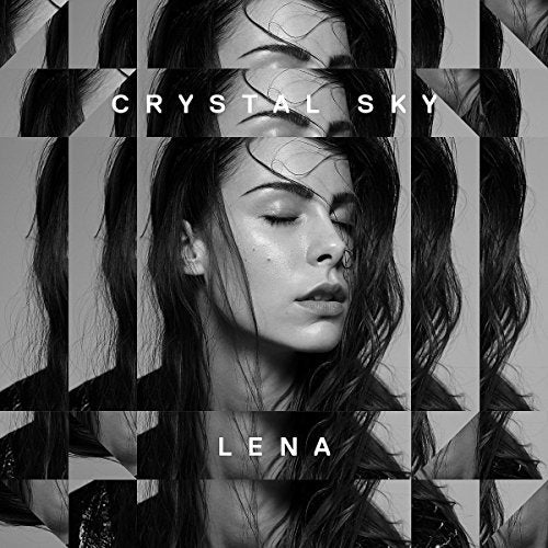 Black and white album cover featuring a woman's face in a grid pattern.