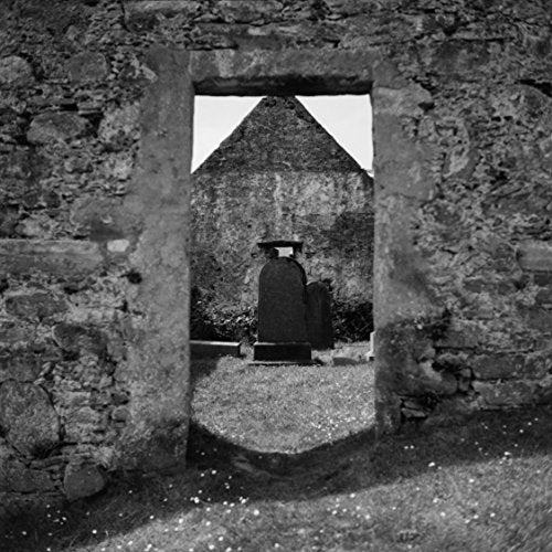 A black and white vinyl record cover with a man in robes standing in a doorway.