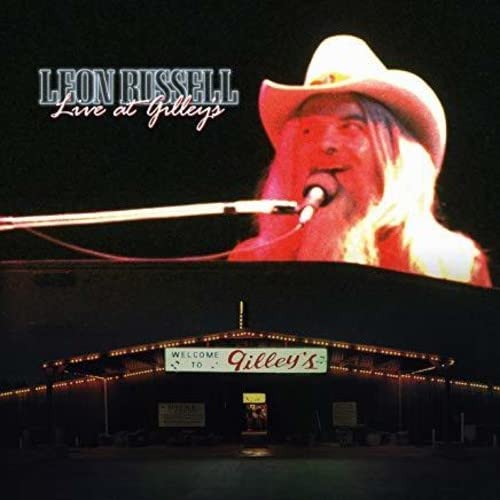 Leon Russell album cover featuring him with a microphone at Gilley's.
