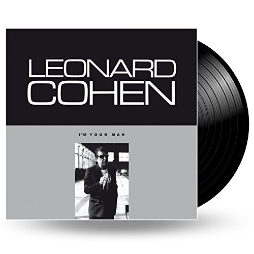 Leonard Cohen's "I'm Your Man" vinyl record with black cover and portrait.