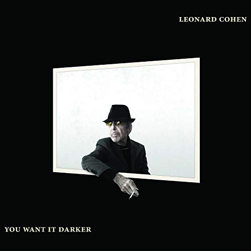 Leonard Cohen in a black hat and suit against a white rectangular background.