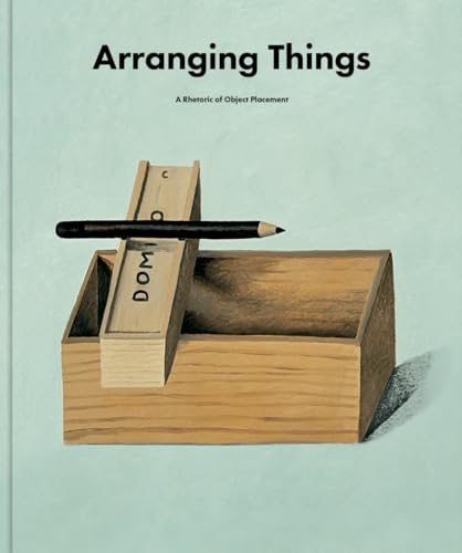Book cover with wooden blocks and a pencil, titled “Arranging Things.”