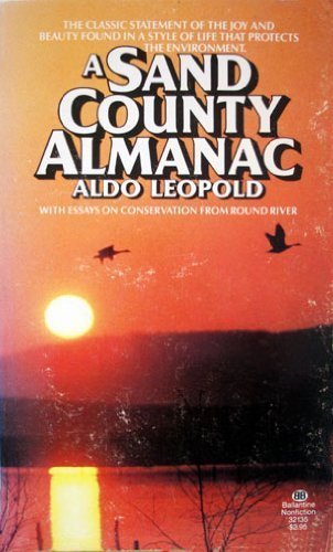 Book cover of A Sand County Almanac by Aldo Leopold featuring a sunset scene.