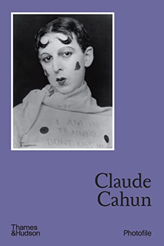Book cover featuring a black-and-white self-portrait of Claude Cahun on a purple background.