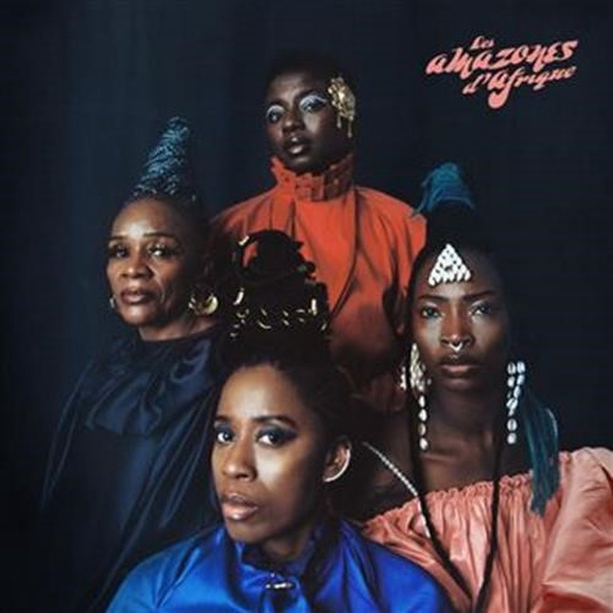 Four Black women with elaborate hairstyles and adornments, album cover.