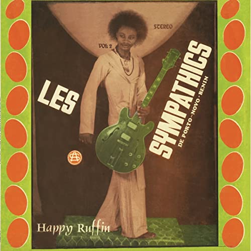 Vinyl album cover featuring a man with a green guitar.