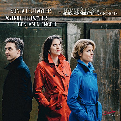 CD cover featuring three people in coats, with text above and logos below.