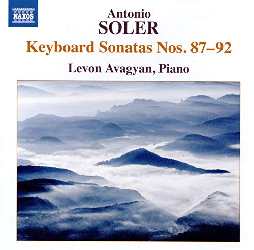 "CD cover featuring a blue-toned mountain landscape with fog and artist information."