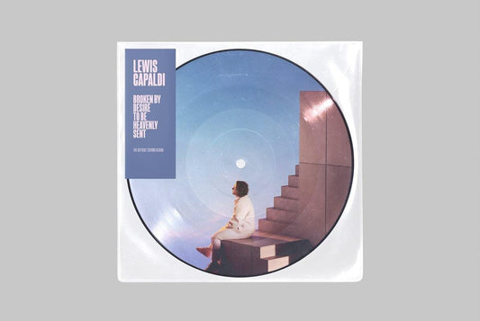 "Lewis Capaldi vinyl record with a man sitting on a staircase, in a plastic sleeve."